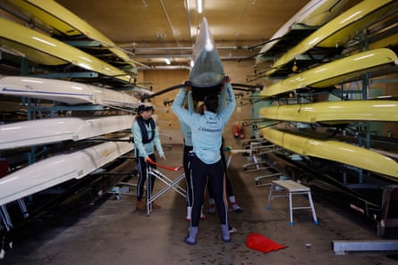 The Cambridge University Boat Club women’s blue boat put their vessel back in the Ely boathouse after a training session on the Great Ouse.