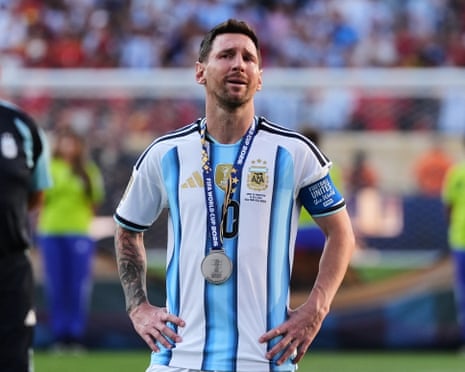 Lionel Messi, wearing a World Cup runners-up medal, crying