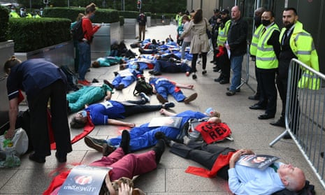 Protesters on the pavement outside JP Morgan