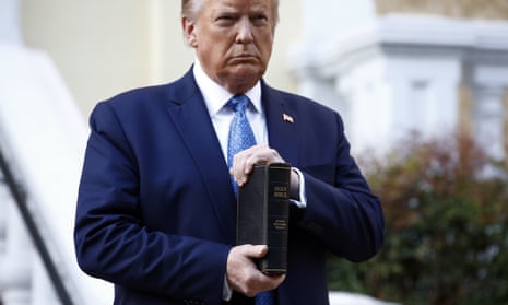 FILE - In this June 1, 2020, file photo, President Donald Trump holds a Bible as he visits outside St. John’s Church across Lafayette Park from the White House in Washington. Part of the church was set on fire during protests on Sunday night. (AP Photo/Patrick Semansky, File)