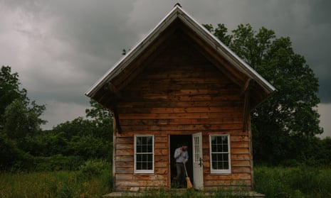 a man sweeps his home