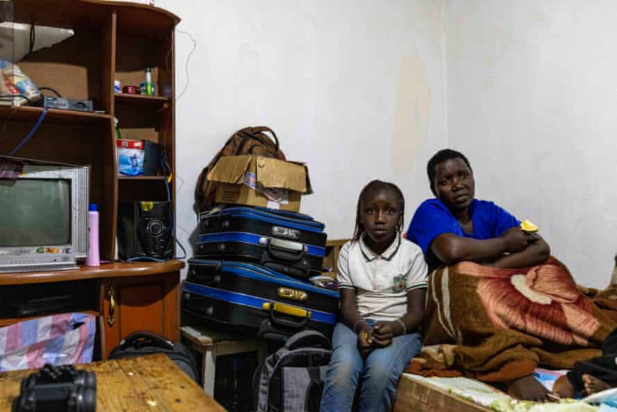 Mary Bosibori and her nine-year-old daughter. Bosibori's husband, Bernad Mogaka, was killed trying to salvage belongings from their partly demolished house