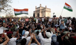 Demonstrators attend a protest against Sunday’s attacks on students at JNU