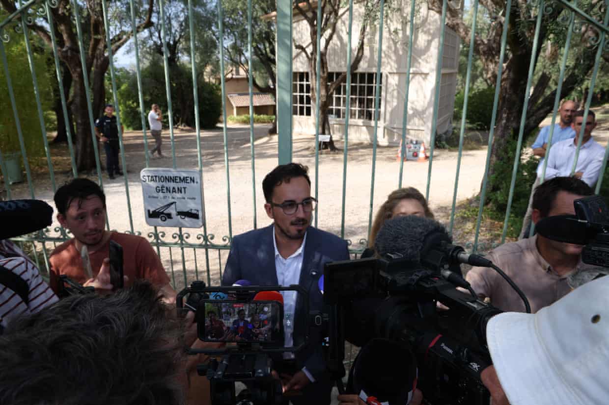 The mayor of Cagnes-sur-Mer talking to reporters at the museum gates.