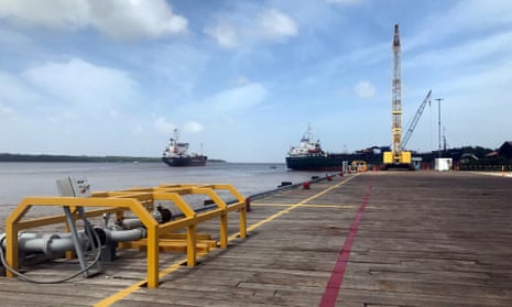 Vessels carrying supplies for an offshore oil platform operated by Exxon Mobil on the Demerara River south of Georgetown in Guyana.