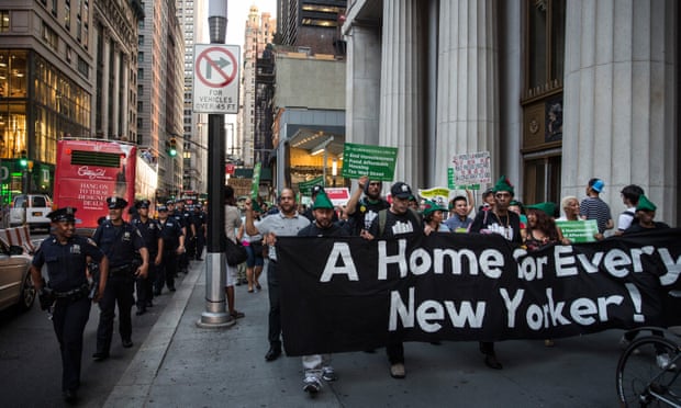 Activists march to New York’s City Hall to demand more affordable housing options for the homeless and poor.