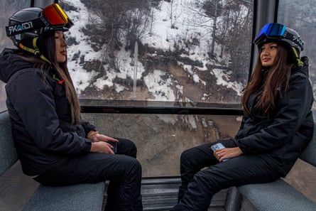 Two posh Kazakh girls, snowboarders and social networkers, sit in a cabin of the cable car that takes them to the 2,200-metre-high Shymbulak ski resort on the outskirts of Almaty. “Originally discovered in 1940, skiers had to climb the mountains on foot (which took about 3 hours). In 1954, a 1,500 metre ski lift was built.
