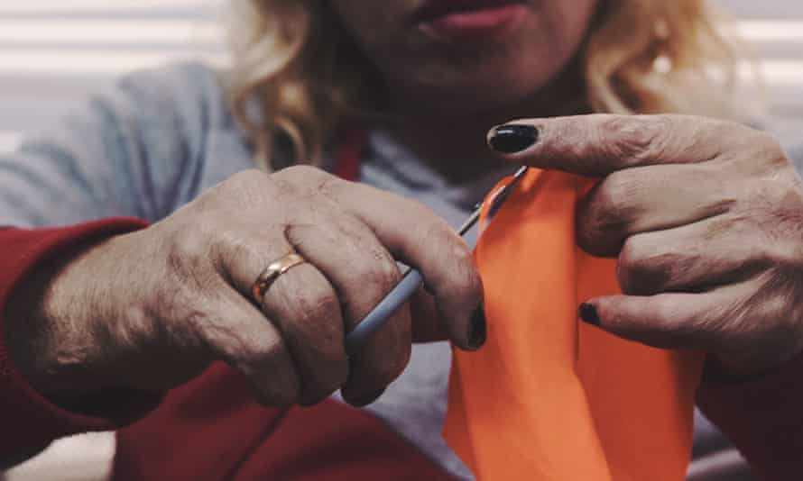 A Love Welcomes seamstress at work