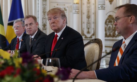 Donald Trump is flanked by the acting defense secretary, Patrick Shanahan, left, and Mick Mulvaney, his acting chief of staff, at a meeting with Caribbean leaders in Mar-a-Lago last month.
