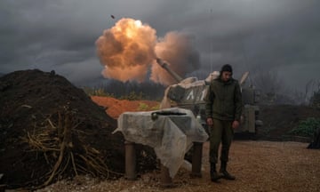 An Israeli mobile artillery unit fires a shell towards Lebanon