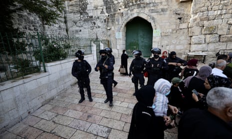 Israeli Forces are seen outside al-Aqsa mosque with worshippers