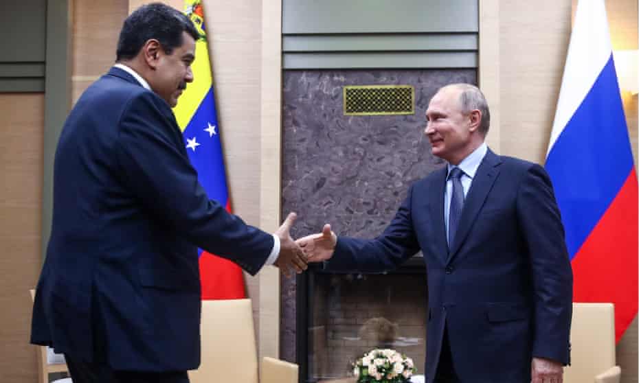 Nicolás Maduro and Vladimir Putin shake hands during a meeting at the Novo-Ogaryovo residence in Russia on 5 December. 