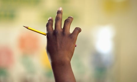 Close up of African boy raising hand