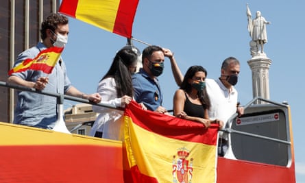 The Vox party’s leader, Santiago Abascal, centre, and colleagues onboard a bus during a protest in Madrid on Saturday