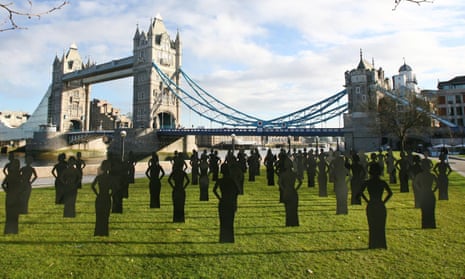 Female silhouettes stand in Potters Fields Park in central London