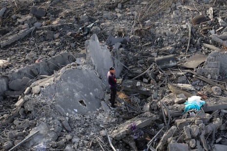 A man stands at the site of an Israeli strike on a house, in Khan Younis, in the southern Gaza Strip, on Thursday.