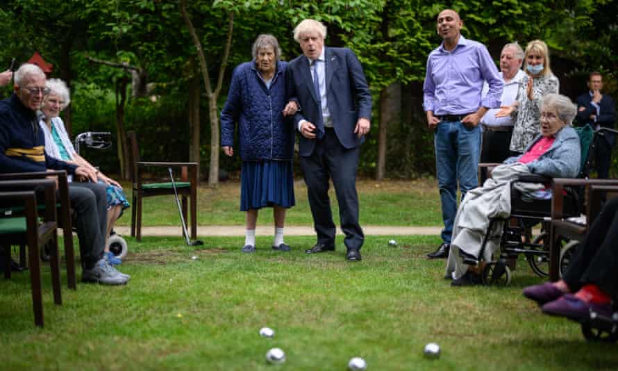 Boris Johnson plays petanque with residents of a residence