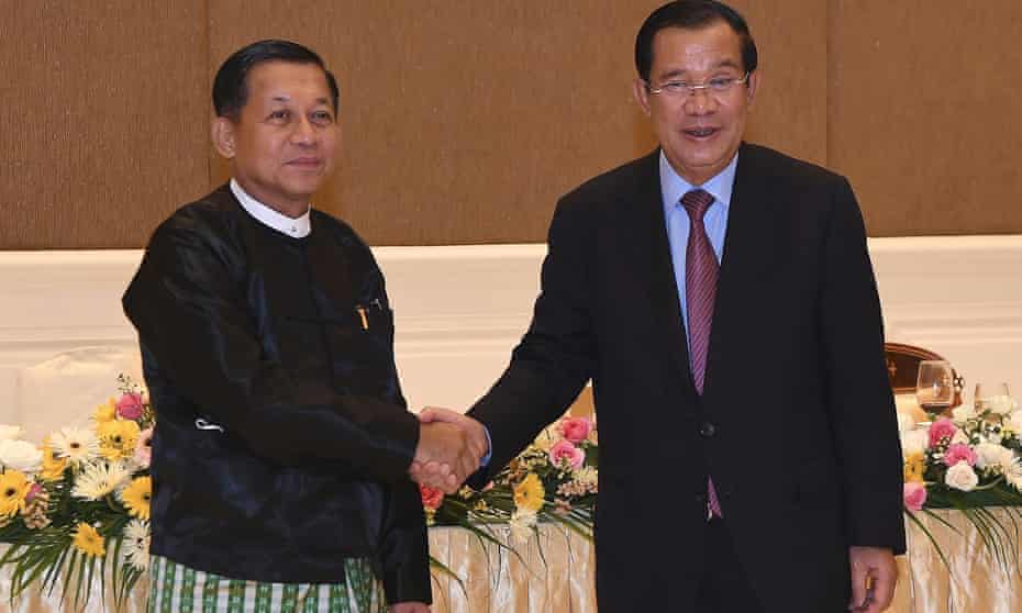 Cambodian prime minister Hun Sen greets Myanmar’s military ruler Min Aung Hlaing, left