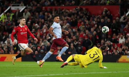 Ollie Watkins lifts the ball over Martin Dubravka to give Aston Villa the lead at Manchester United.