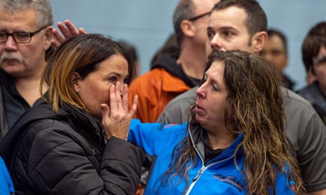 Two GM workers react at a union meeting near the General Motors’ assembly plant in Oshawa in Ontario.