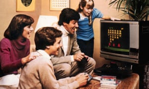 A family gathers around Space Invaders. But not all the games we loved are so well-remembered