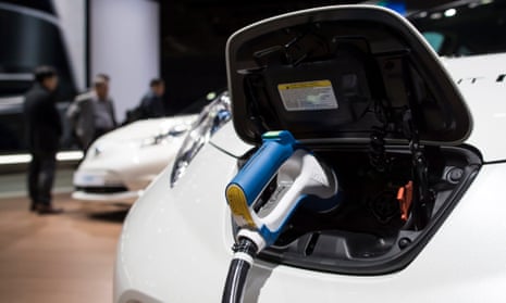 An electric vehicle charger is displayed at the Paris Motor Show