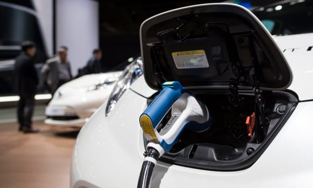 An electric vehicle charger is displayed at the Paris Motor Show