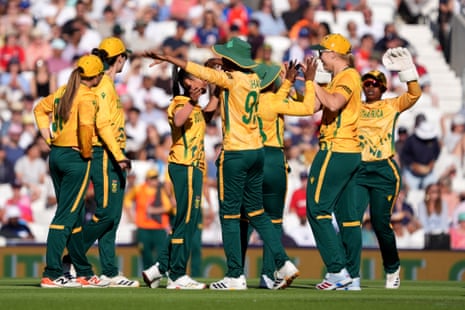 South Africa's players celebrate after Shabnim Ismail (third left, partially hidden) took the wicket of England's Amy Jones.