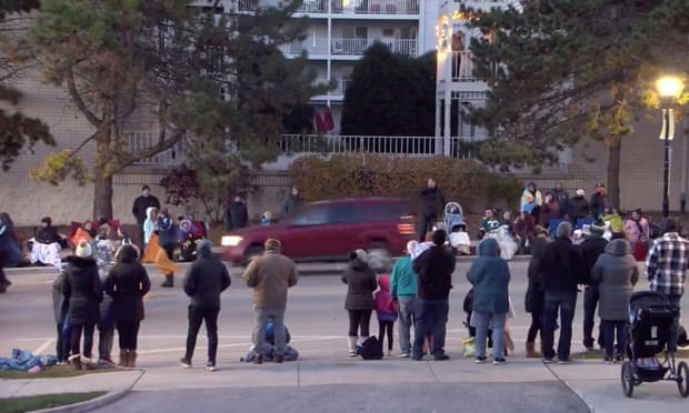 Social media footage shows an SUV speeding through Wisconsin Christmas parade.