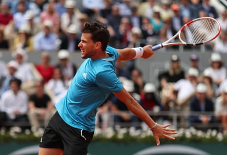 Dominic Thiem smashes a return to Nadal.