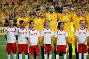 Tim Cahill, left, in the starting line-up during the anthems.