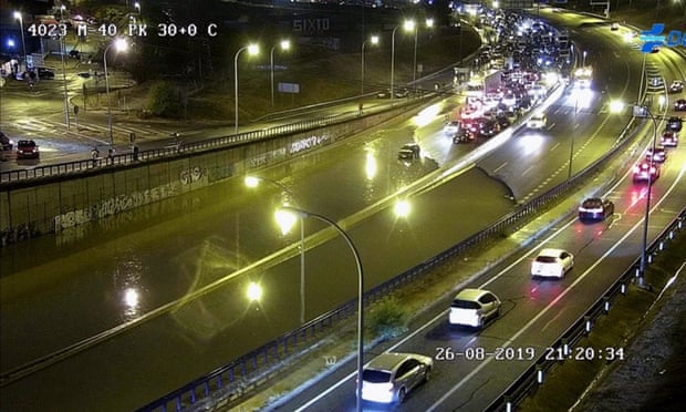 A CCTV image shows cars stranded on the flooded M40 ring road in Madrid