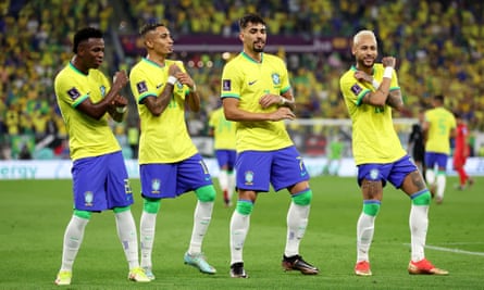Neymar of Brazil celebrates with Raphinha, Lucas Paqueta and Vinicius Junior after scoring the team’s second goal against South Korea.