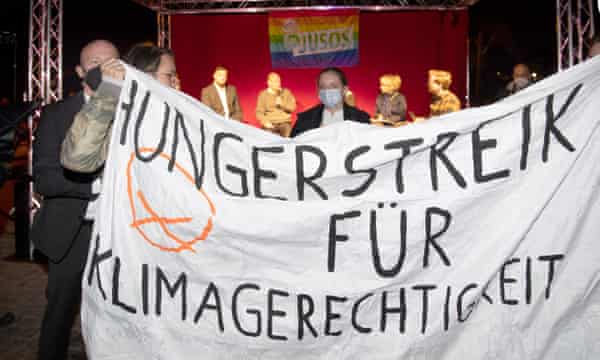 Climate activists in Potsdam demand a live televised debate with Olaf Scholz.
