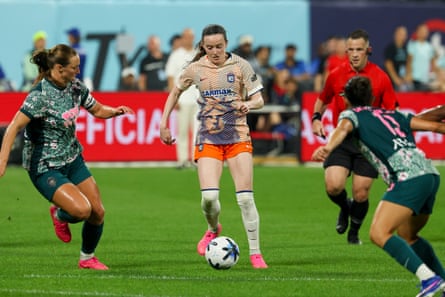 Rose Lavelle dribbles through defenders on Wednesday night.