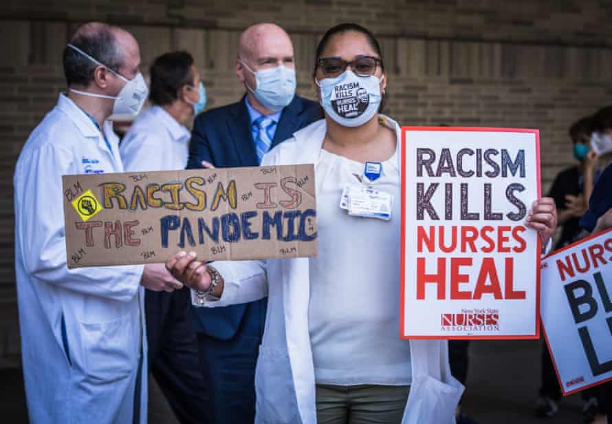 Nurses take a stand for racial justice outside of Bellevue hospital in New York City, in June.