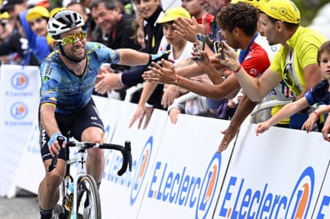Mark Cavendish, the British cyclist, greets fans at the Tour de France.