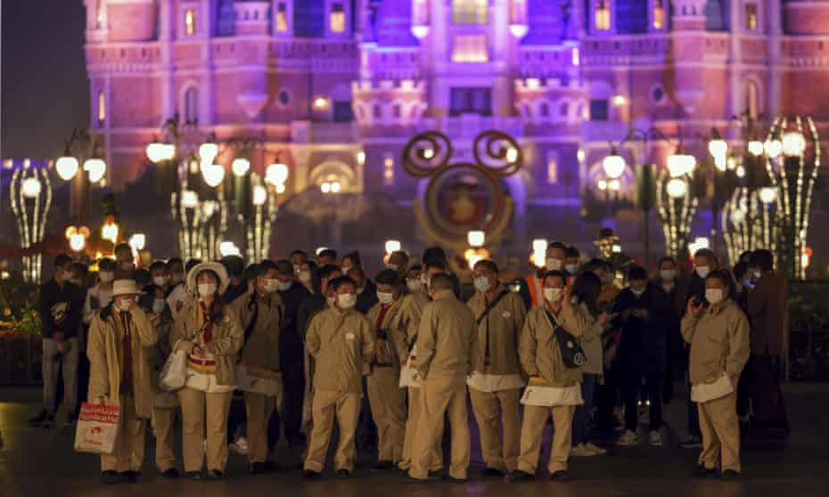 Fireworks boomed as the visitors at Shanghai Disneyland waited for their Covid-19 test results, surrounded by healthcare workers dressed from head to toe in the white protective suits