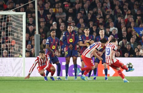 Atletico Madrid’s Julian Alvarez (right) opens the scoring from a free-kick at Barcelona.