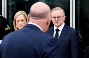 Prime minister Anthony Albanese and finance minister Katy Gallagher watch opposition leader Peter Dutton lay a wreath at the statue of Queen Elizabeth II at Parliament House in Canberra on 10 September.