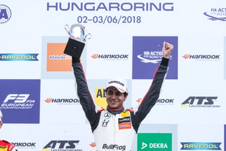 Formula 3 driver Enaam Ahmed celebrates on the podium at Hungaroring.