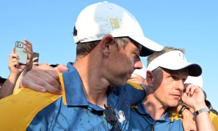 Europe’s Rory McIlroy and Luke Donald embrace after winning the Ryder Cup.