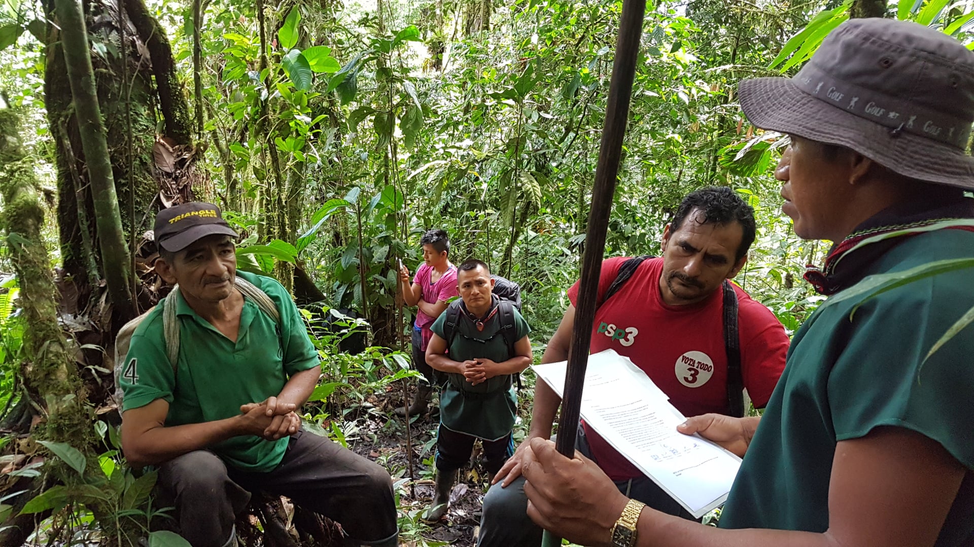 Members of Sinangoe’s guardia indigena encounter illegal miners in their territory. The man wearing the baseball cap is the president of the local small-scale miners’ association. Photograph: Nicolas Mainville/Amazon Frontlines
