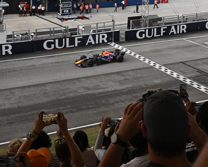 Max Verstappen wins his first race of season at Bahrain GP after rain delay causes chaos – live reaction