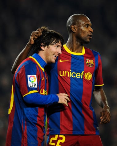 Messi and Abidal pictured playing for Barcelona in 2011.