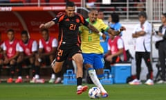 Colombia's Daniel Muñoz and Brazil's Raphinha fight for the ball during the 2024 Copa America match at Levi's Stadium in Santa Clara, California