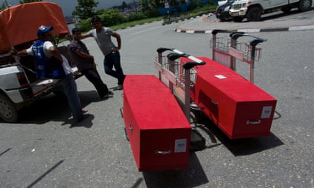 The coffins of Phatwari Chaudhari and Asharam Tharu outside Kathmandu Airport, two of five Nepalese migrant workers run over and killed by a vehicle in the Lusail City development in 2013