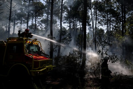 Firefighters work to put out hotspots at Le Grand Crohot amid drought conditions following a heatwave and water shortages across much of France, Lege-Cap-Ferret, Gironde, France.
