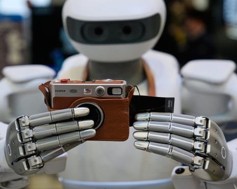 A Sharpa North robot uses a camera at CES 2026 in Las Vegas.