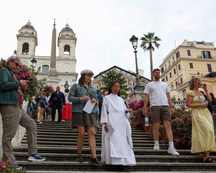 A nun and tourists on Rome’s Spanish Steps